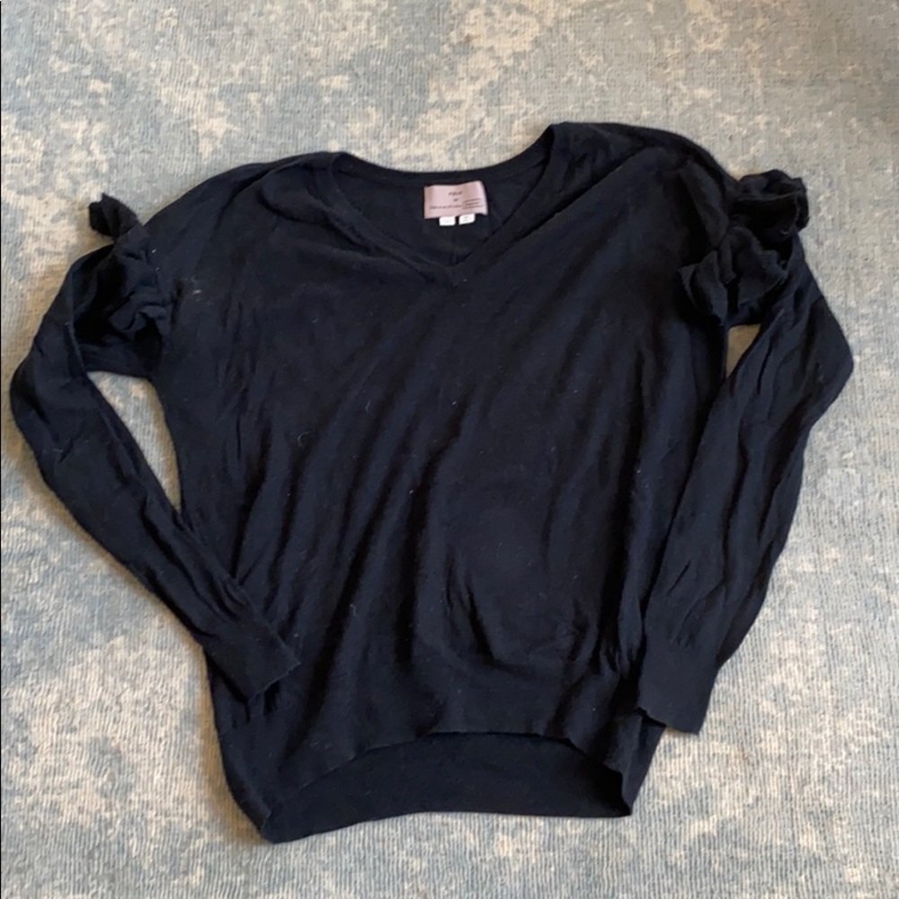 Black Anthropologie sweater with ruffle sleeves